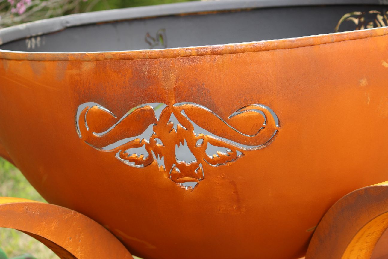 Africa’s Big Five fire pit during the day, showing close up of Cape Buffalo cut out and round bowl design.