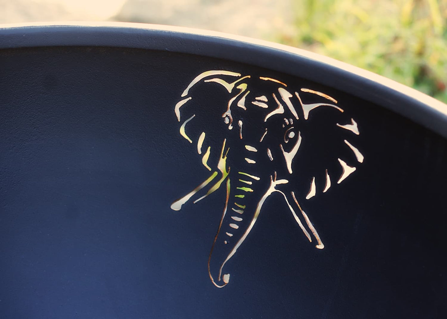 Interior view of elephant cutout design inside Africa's Big Five Fire Pit Art bowl.