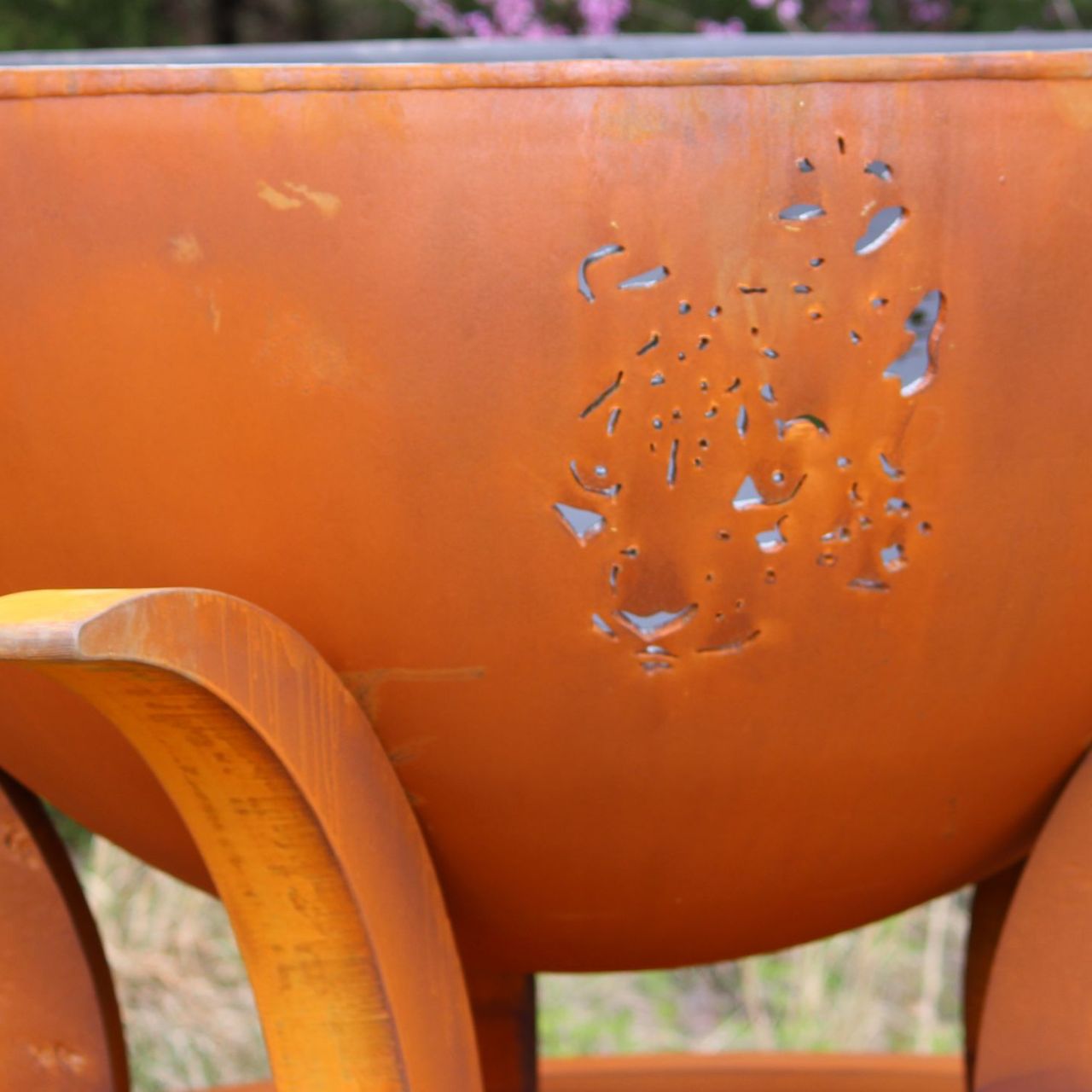 Close-up of leopard cutout on Africa's Big Five Fire Pit Art carbon steel bowl.