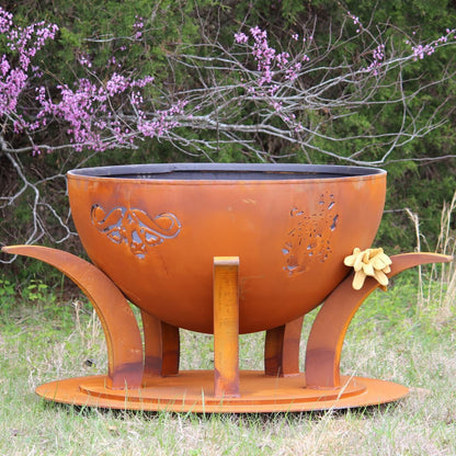 Side view of Africa's Big Five steel fire pit showing both the cape buffalo and the leopard cut outs.  Made by Fire Pit Art.