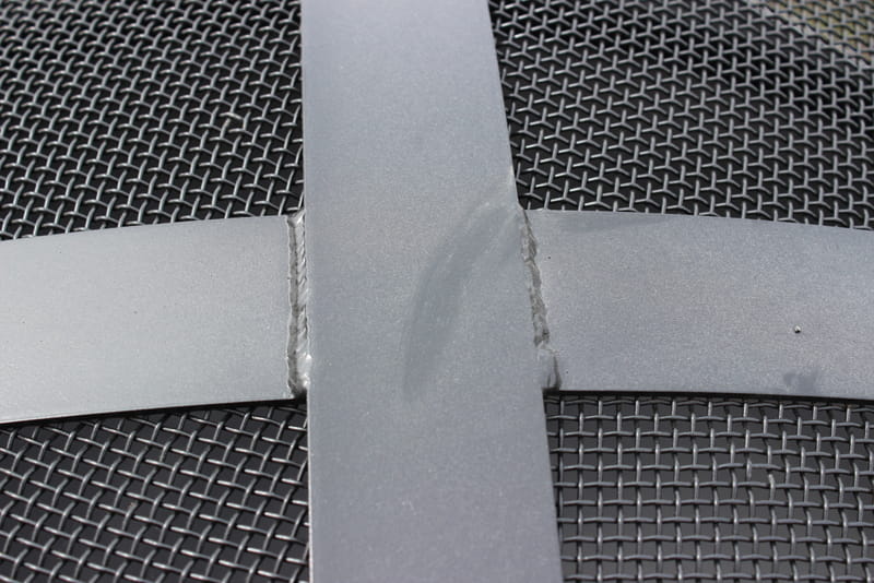 Close-up of cross section of 304 stainless steel bands and stainless steel mesh of 27.5” Spark Guard. Fits Fire Pit Art style: Saturn (sold separately).