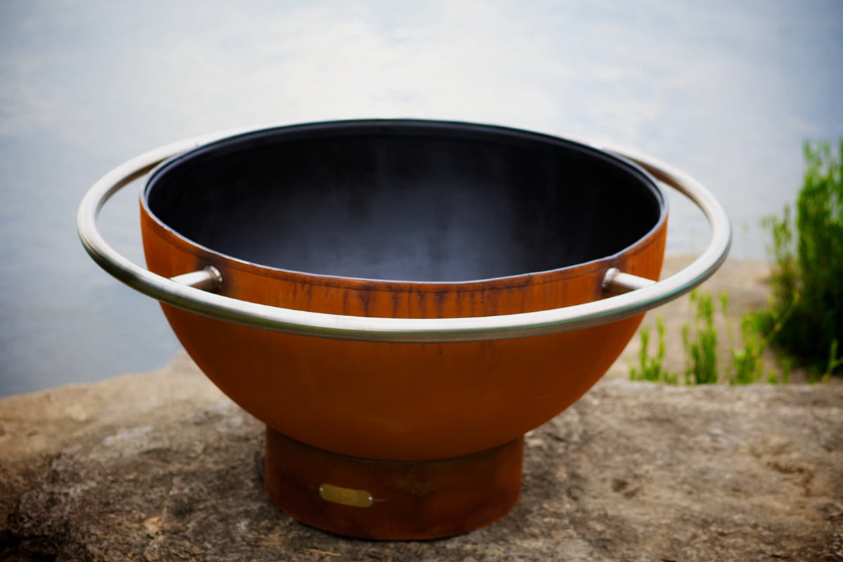 Top view of Bella Luna 48" carbon steel fire pit showing circular opening and steel ring around full fire pit.