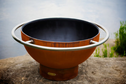 Top view of Bella Luna 48" carbon steel fire pit showing circular opening and steel ring around full fire pit.