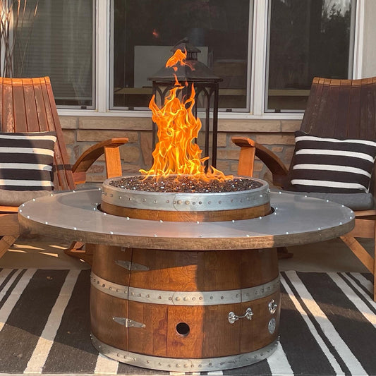 46-inch wine barrel coffee table fire pit with flames – choose from rustic propane or natural gas.