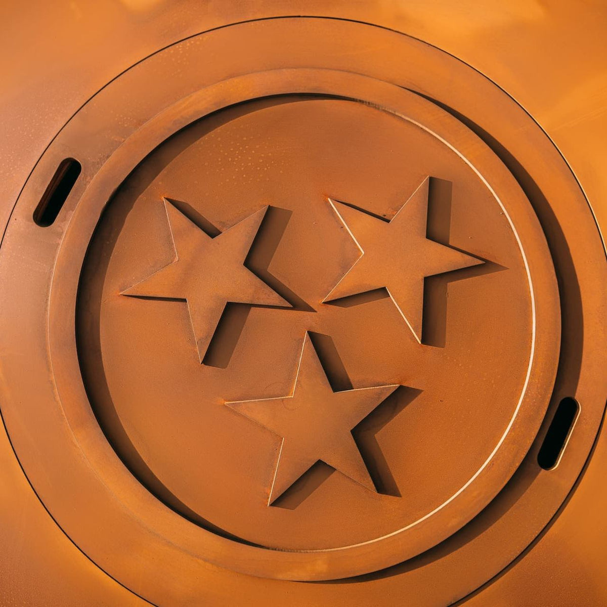 Main image of the Magnum 54" carbon steel fire pit with decorative three-star lid from Fire Pit Art. Made in USA.