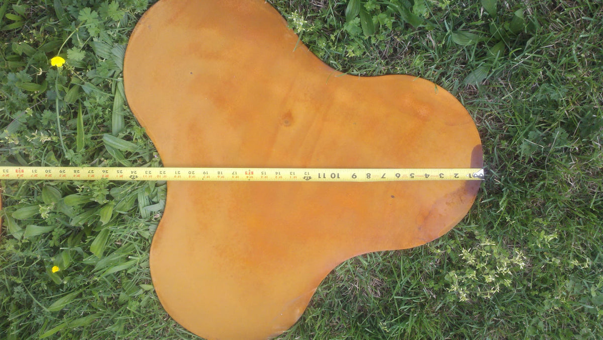 Measurement photo of Nepal fire pit’s tripod-style base showing steel support width.