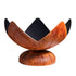 Rust-colored Fire Flower wood burning fire bowl with petal-like steel edges and rounded base.