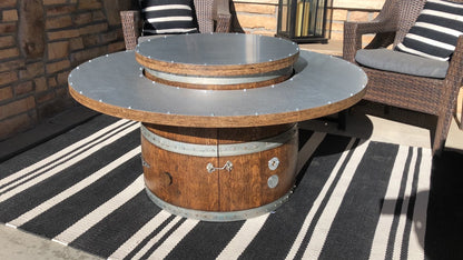 46" wine barrel coffee table fire pit with lid closed on patio with chairs – doubles as a sturdy outdoor table when the fire is not in use.  Made in the USA.